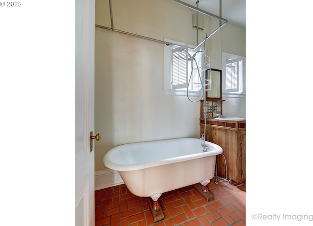 bathroom featuring a tub and sink