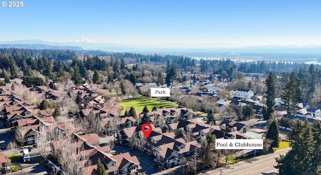 birds eye view of property featuring a mountain view