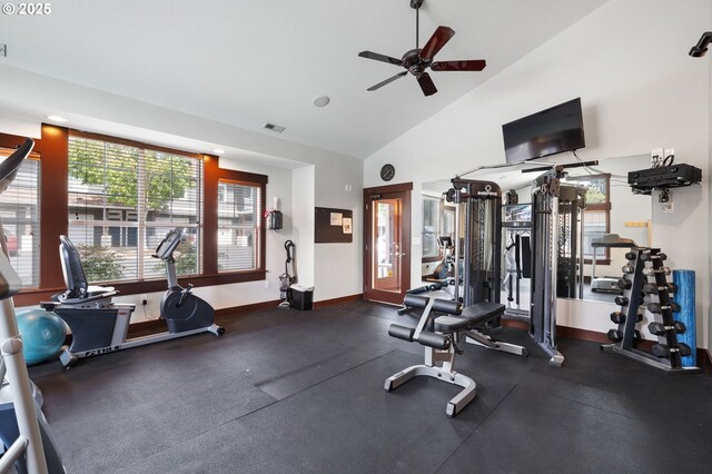 exercise room featuring high vaulted ceiling and ceiling fan