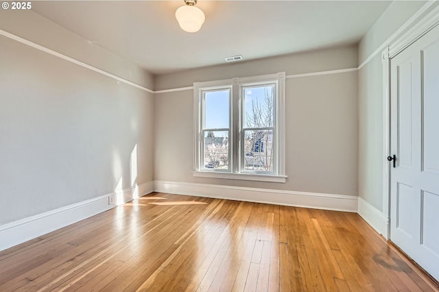 unfurnished bedroom featuring light wood-type flooring, visible vents, and baseboards