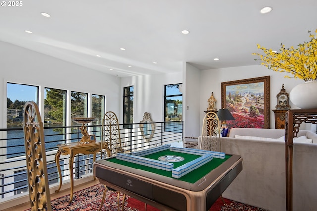 rec room featuring a water view and recessed lighting