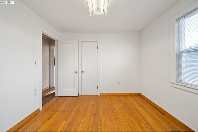 4616 SE 128th Ave, Portland, OR 97236 - spare room with light wood-style flooring and baseboards