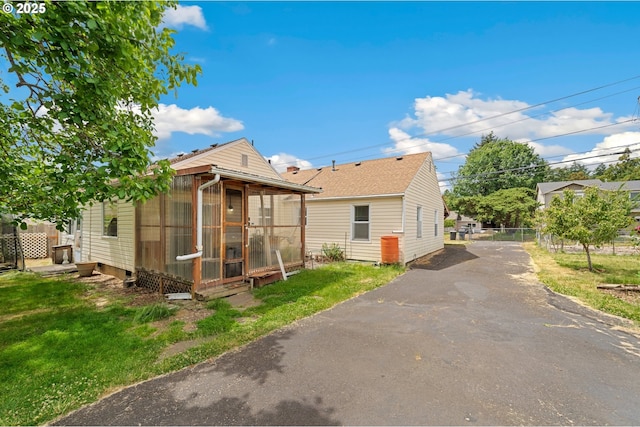 4616 SE 128th Ave, Portland, OR 97236 - rear view of house featuring asphalt driveway and a sunroom