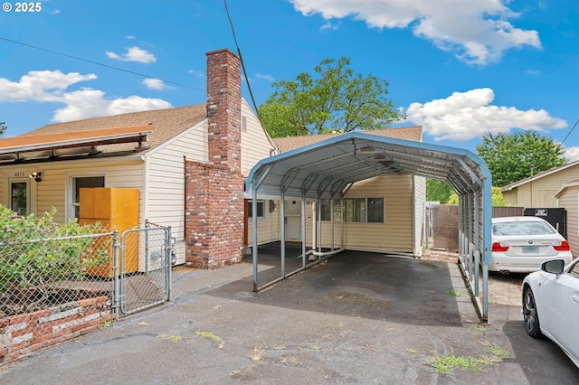 4616 SE 128th Ave, Portland, OR 97236 - view of parking / parking lot with a gate, a detached carport, and asphalt driveway