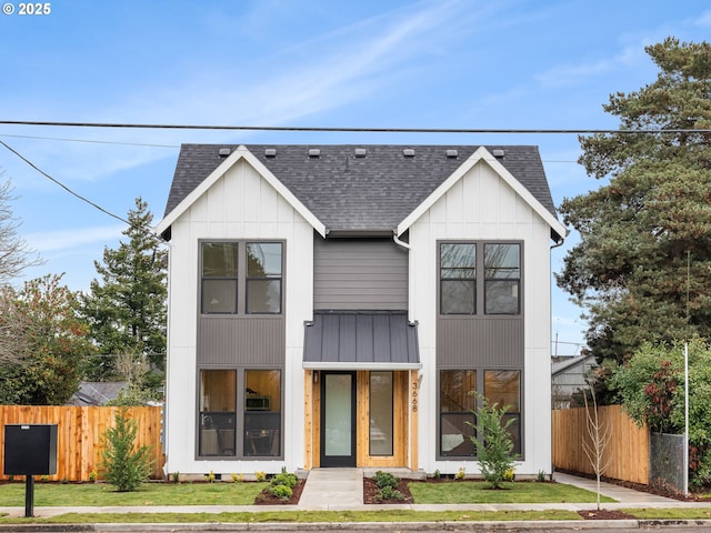 modern farmhouse style home with a front yard