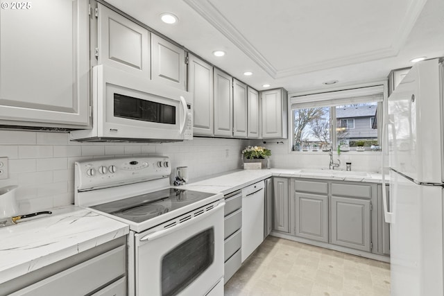 kitchen with white appliances, sink, gray cabinetry, and ornamental molding