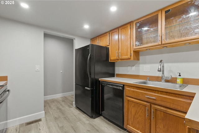 434 SW Eastman Pkwy, Gresham, OR 97080 - kitchen featuring black appliances, a sink, light wood-type flooring, light countertops, and recessed lighting