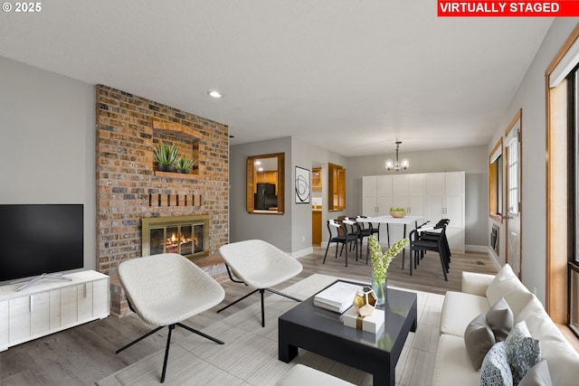 434 SW Eastman Pkwy, Gresham, OR 97080 - living area featuring a chandelier, wood finished floors, a fireplace, baseboards, and recessed lighting