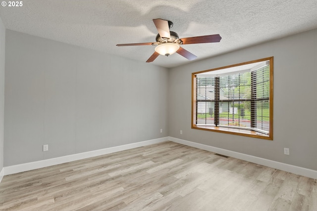 434 SW Eastman Pkwy, Gresham, OR 97080 - spare room with wood finished floors, a textured ceiling, ceiling fan, and baseboards