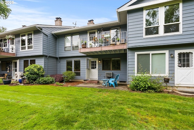434 SW Eastman Pkwy, Gresham, OR 97080 - rear view of property featuring a balcony, a chimney, and a yard