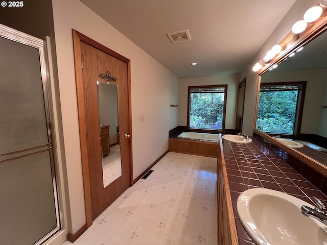 42250 Cedar Hollow Rd, Port Orford, OR 97465 - bathroom with a bath, double vanity, a stall shower, and recessed lighting