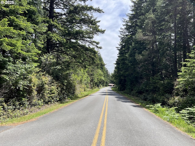 42250 Cedar Hollow Rd, Port Orford, OR 97465 - view of asphalt street featuring a view of trees