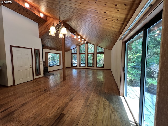 42250 Cedar Hollow Rd, Port Orford, OR 97465 - unfurnished living room featuring a chandelier, wooden ceiling, hardwood / wood-style floors, high vaulted ceiling, and rail lighting
