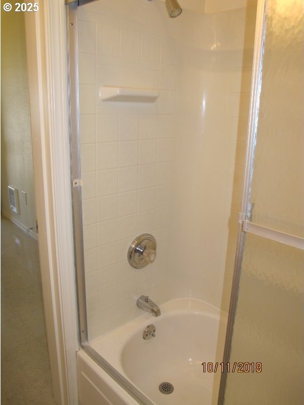 bathroom featuring washtub / shower combination
