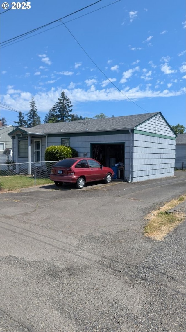 8428 SE 60th Ave, Portland, OR 97206 - view of front facade featuring an attached garage and roof with shingles