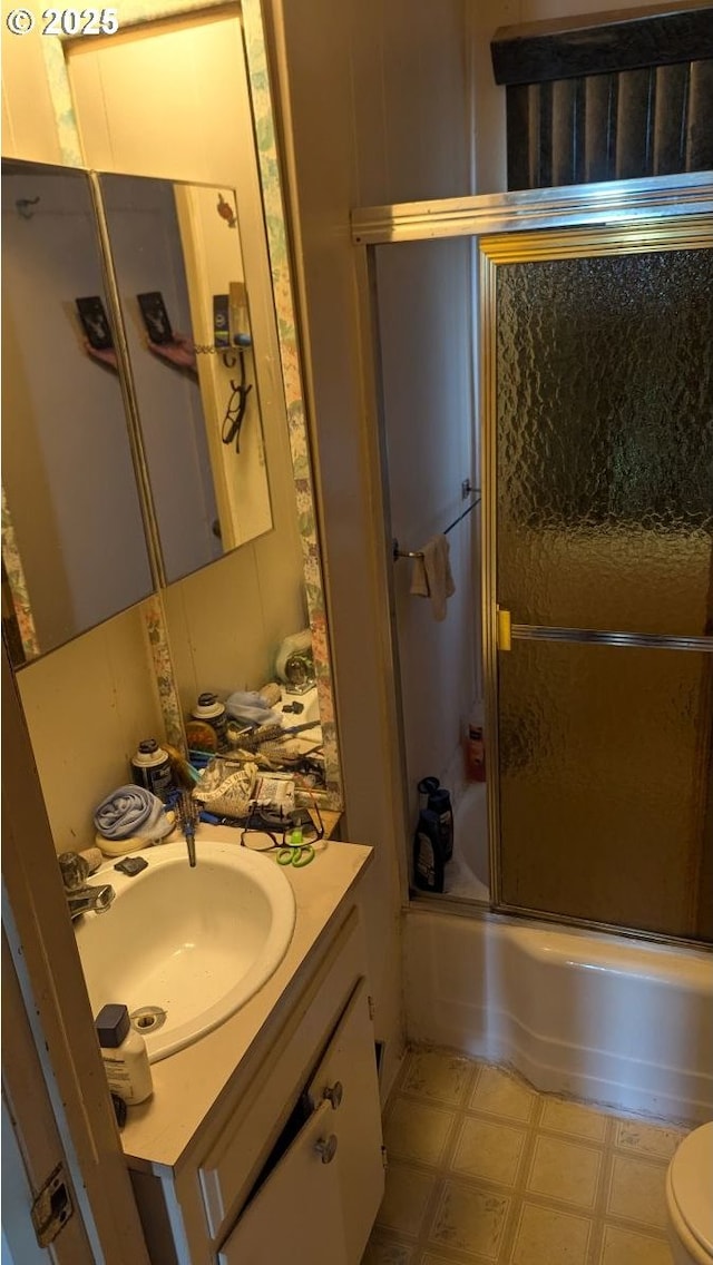 8428 SE 60th Ave, Portland, OR 97206 - full bath featuring vanity, tile patterned floors, bath / shower combo with glass door, and toilet