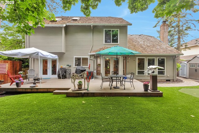 19642 SW 56th Ct, Tualatin, OR 97062 - rear view of house featuring french doors, a deck, a chimney, and a putting green