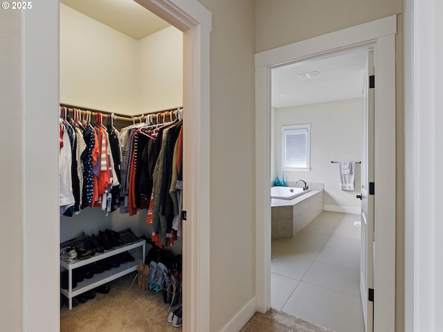 walk in closet featuring light tile patterned floors