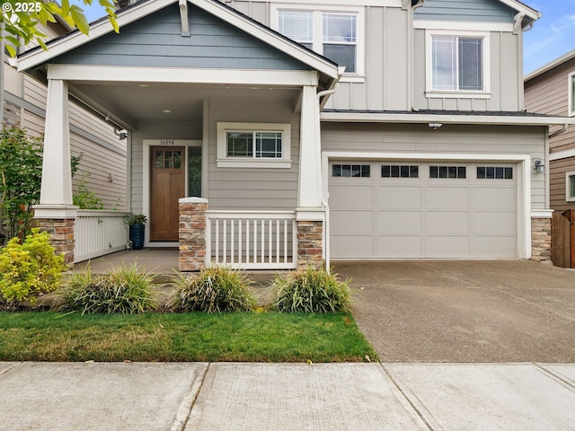 craftsman house featuring a garage and covered porch