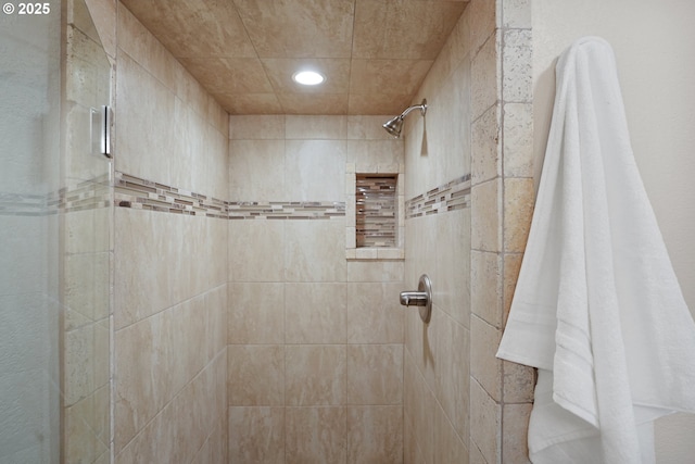 bathroom with recessed lighting and a shower stall