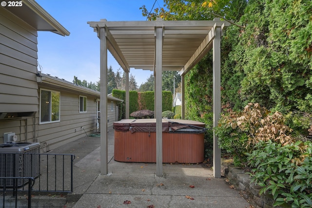 view of patio featuring a hot tub, central AC unit, and a pergola