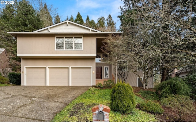 view of front of house with a garage and driveway