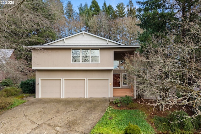 view of front of home featuring a garage and concrete driveway