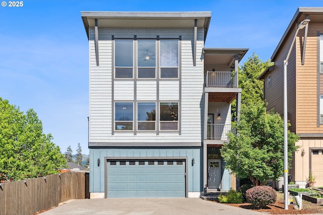 201 Selkirk Ln, Hood River, OR 97031 - view of front of property with a balcony, an attached garage, board and batten siding, and driveway