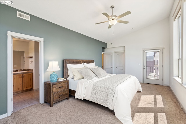 201 Selkirk Ln, Hood River, OR 97031 - bedroom with light carpet, access to exterior, vaulted ceiling, multiple windows, and a sink