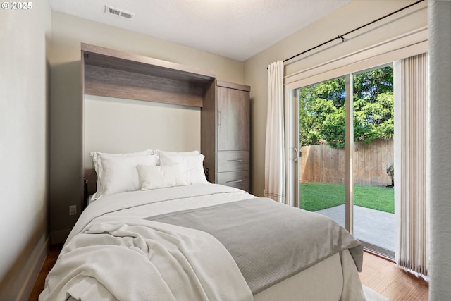201 Selkirk Ln, Hood River, OR 97031 - bedroom featuring access to outside and wood finished floors
