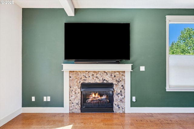 201 Selkirk Ln, Hood River, OR 97031 - detailed view of a stone fireplace, beam ceiling, wood finished floors, and baseboards