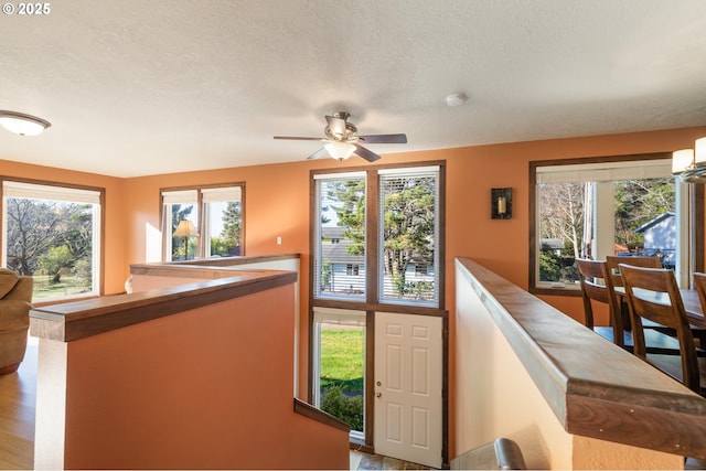 interior space with a healthy amount of sunlight and a textured ceiling