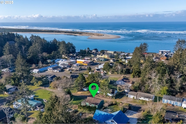 aerial view with a water view and a beach view