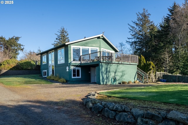 back of house featuring a yard and a deck