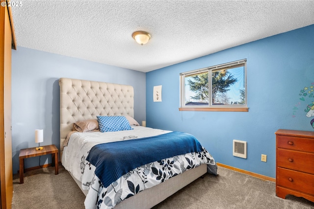 bedroom with light carpet and a textured ceiling