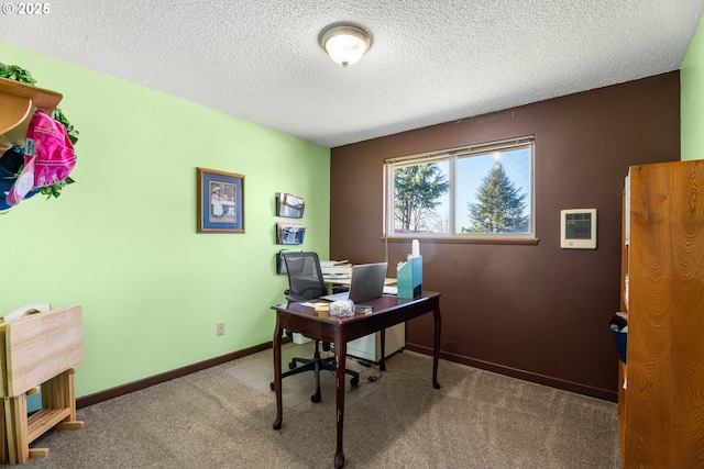 office space featuring carpet flooring and a textured ceiling