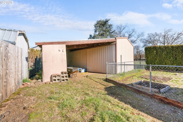 view of outdoor structure with a lawn