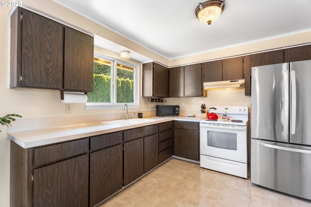 kitchen with stainless steel refrigerator, white range with electric cooktop, sink, and dark brown cabinets