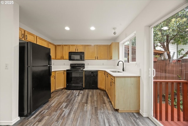8527 N Princeton St, Portland, OR 97203 - kitchen featuring black appliances, dark wood-style floors, light countertops, recessed lighting, and light brown cabinetry