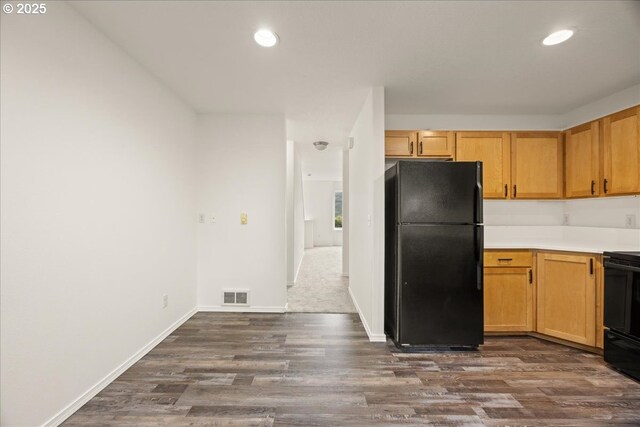 8527 N Princeton St, Portland, OR 97203 - kitchen with freestanding refrigerator, dark wood-type flooring, stove, light countertops, and recessed lighting