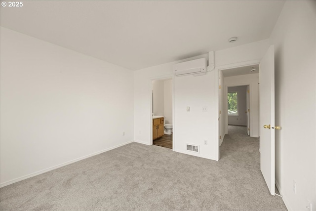 8527 N Princeton St, Portland, OR 97203 - unfurnished bedroom featuring carpet flooring, a wall mounted air conditioner, and ensuite bathroom