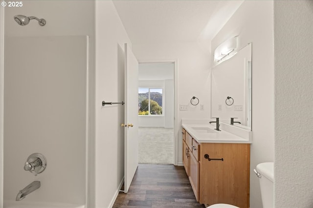 8527 N Princeton St, Portland, OR 97203 - full bathroom featuring vanity, wood finished floors, and shower / washtub combination