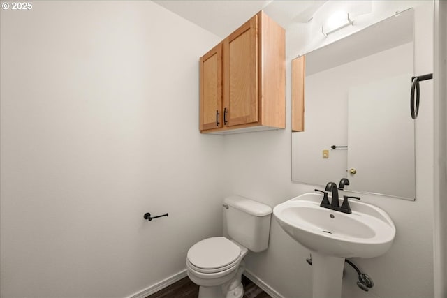 8527 N Princeton St, Portland, OR 97203 - half bathroom featuring toilet and wood finished floors