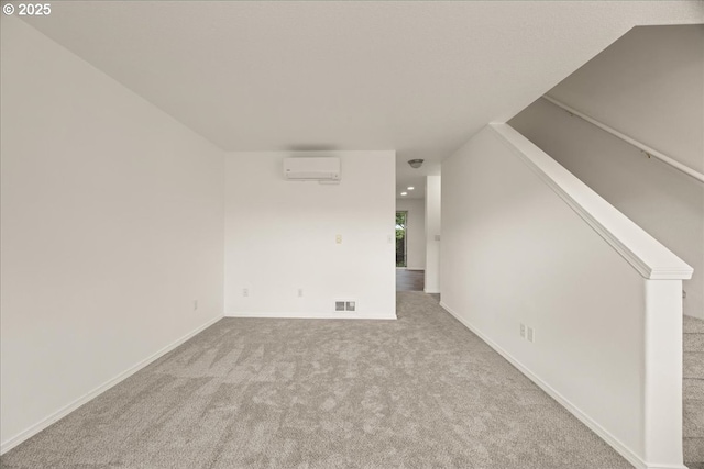 8527 N Princeton St, Portland, OR 97203 - unfurnished room with an AC wall unit and carpet
