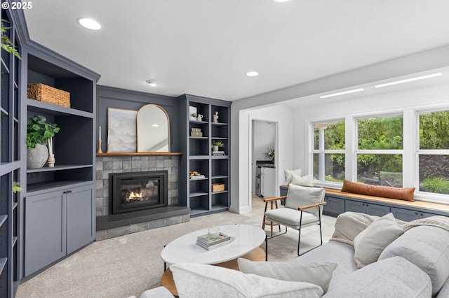 6322 Pony Ct, West Linn, OR 97068 - living room with a tiled fireplace, recessed lighting, built in shelves, and light carpet