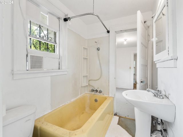 bathroom featuring toilet and shower / washtub combination