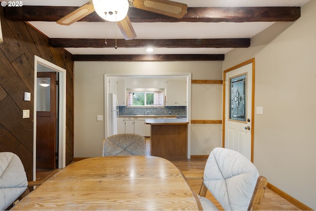 939 Buckhorn Rd, Roseburg, OR 97470 - dining area with light wood-style flooring, beamed ceiling, baseboards, and a ceiling fan