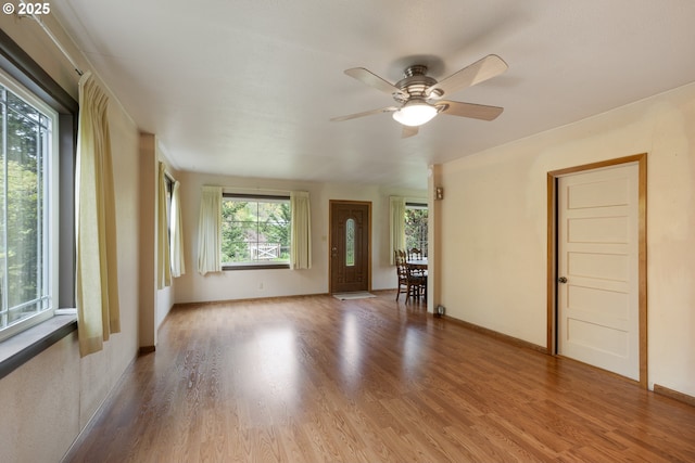 939 Buckhorn Rd, Roseburg, OR 97470 - spare room featuring wood finished floors, ceiling fan, and baseboards