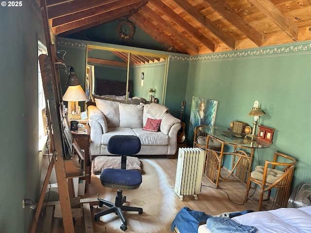 living area with radiator heating unit, wood ceiling, vaulted ceiling with beams, and wood finished floors