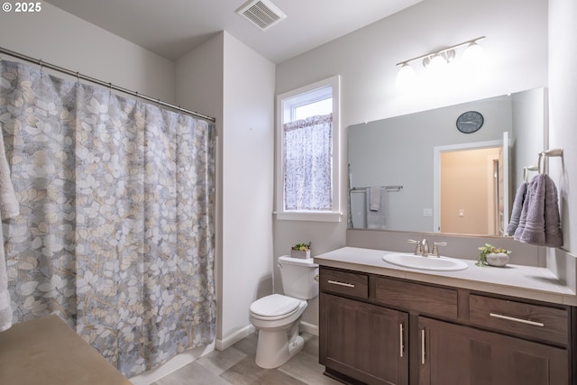 bathroom with toilet, vanity, wood finished floors, baseboards, and a shower with curtain